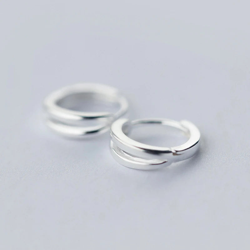 Sterling silver earrings featuring a classic hoop earrings for women look