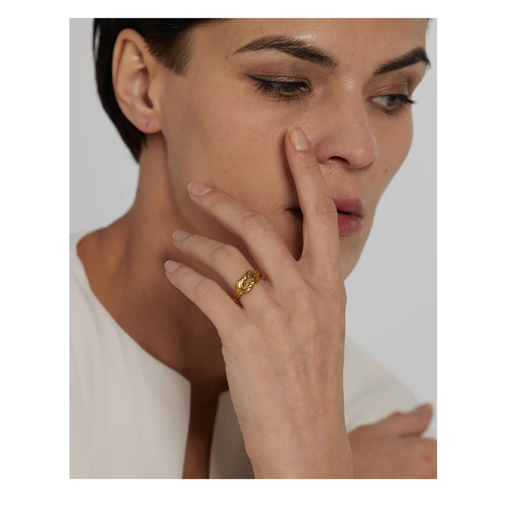 Close view of a gold ring styled as a stainless ring with ring with size ease