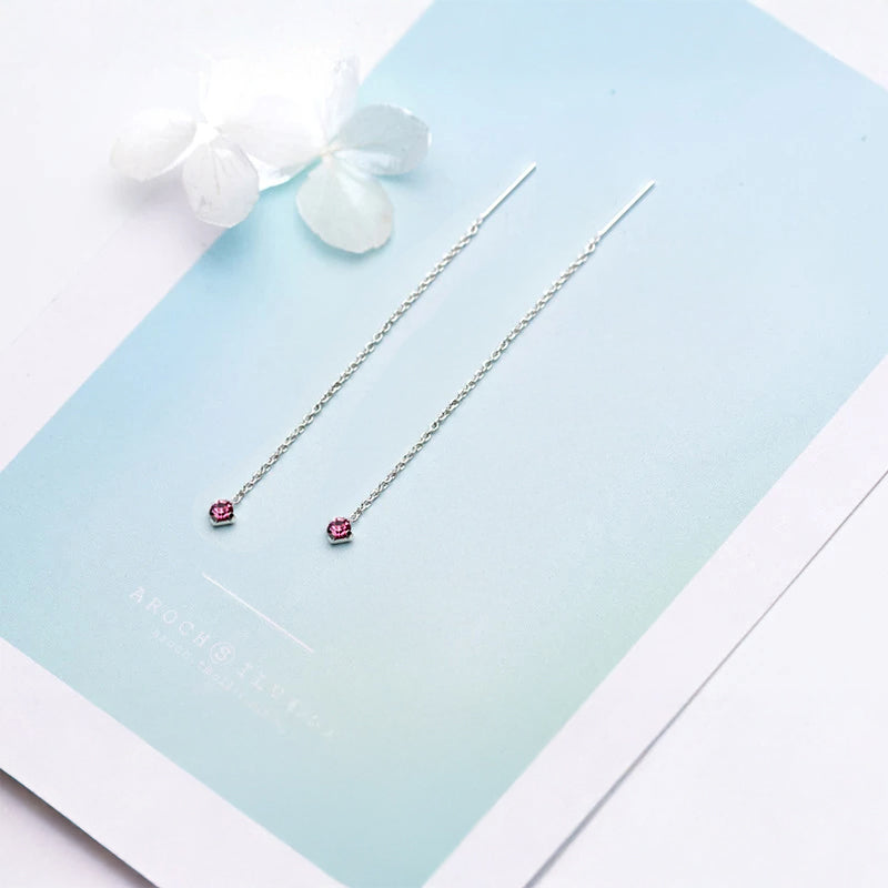 Statement drop earrings with blue stone detail and flowing tassel chain