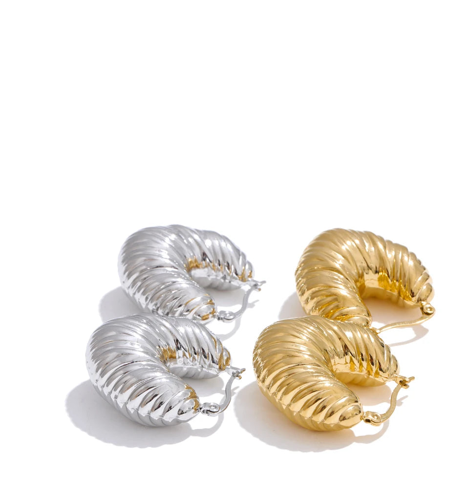 Clean background image of earring earrings in a bold yet lightweight hoop