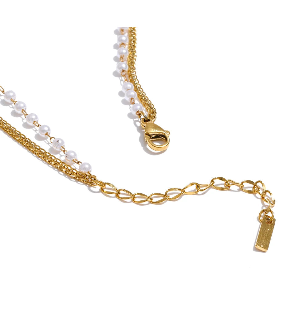 Necklace and necklace layering featuring delicate pearls