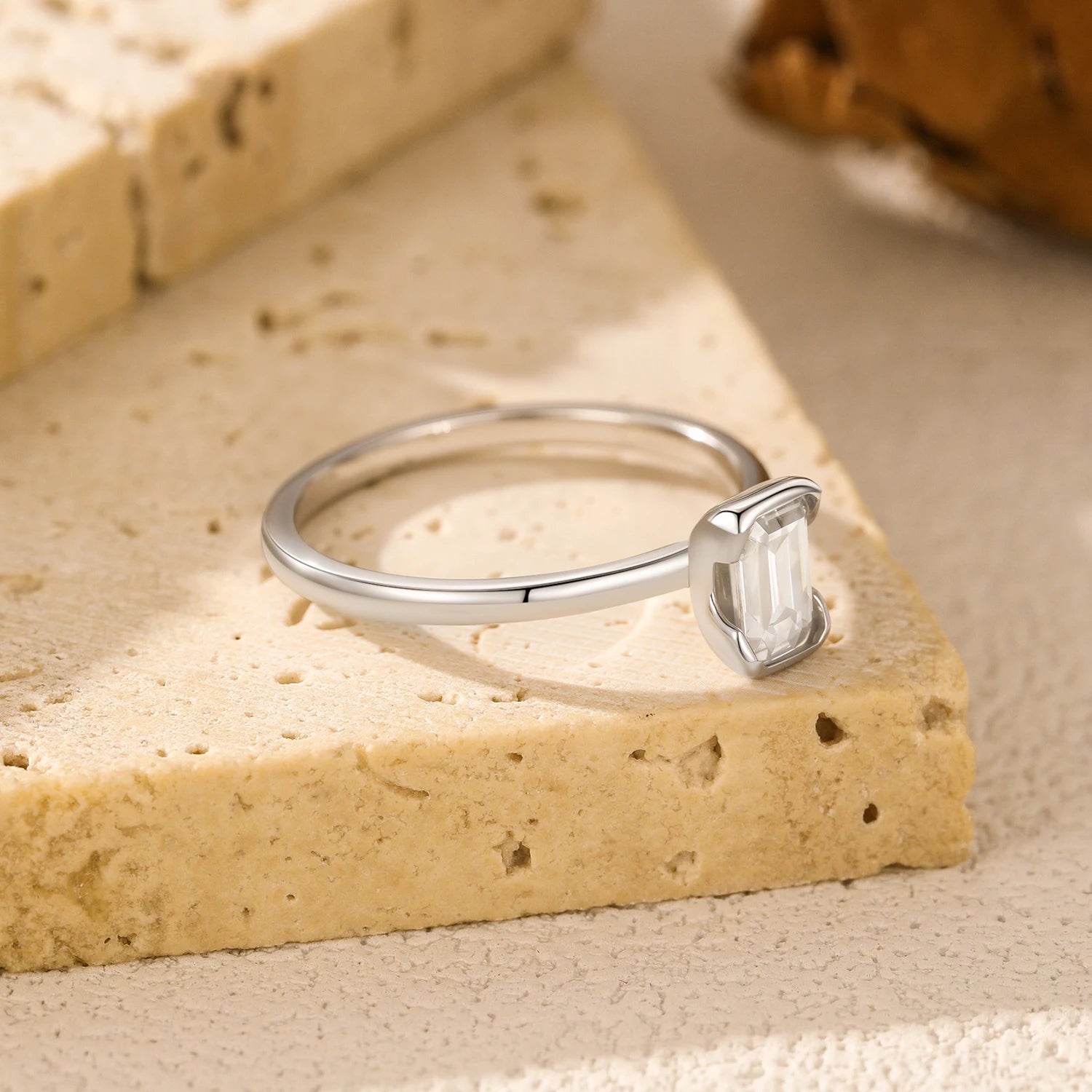 Sterling silver ring size design featuring emerald cut stone