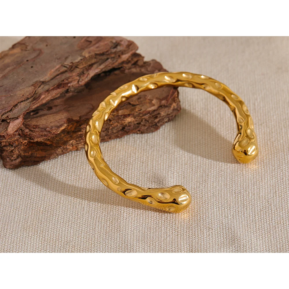Bracelet for gold styled as a gold bangle bracelet with polished edges