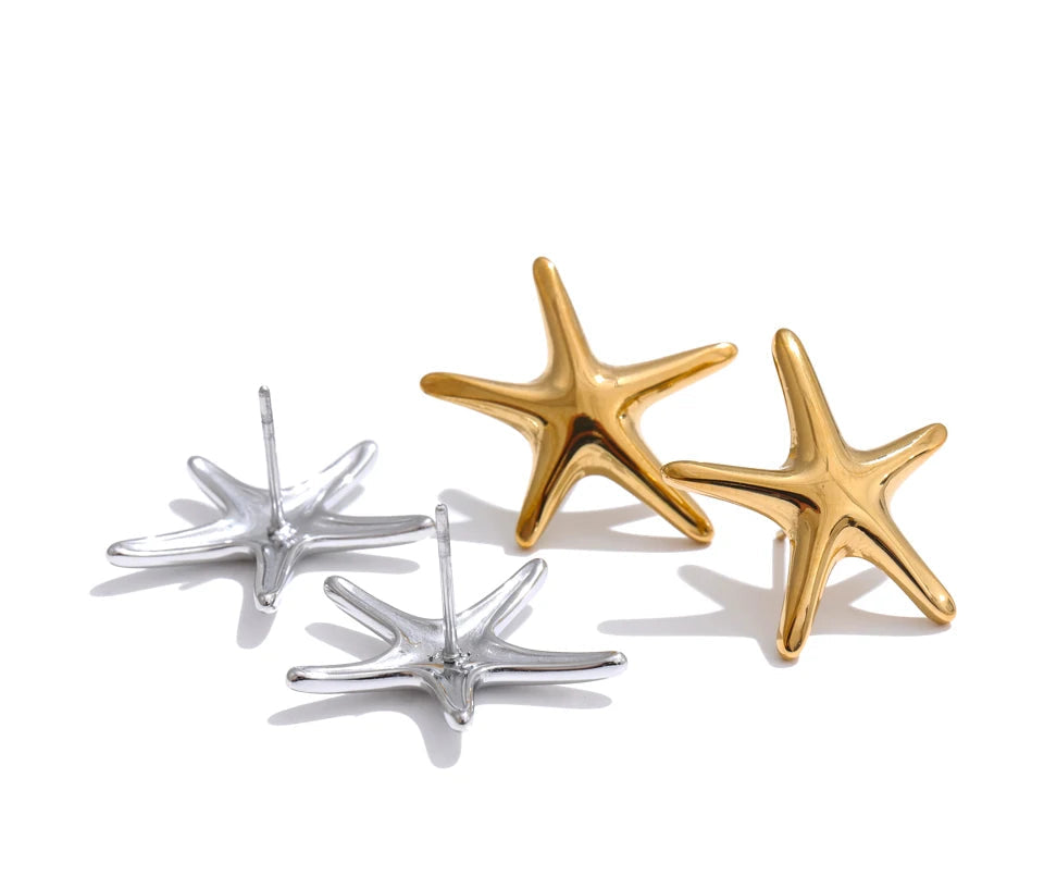 Macro of earrings starfish texture on gold plated surface for elegant ear rings