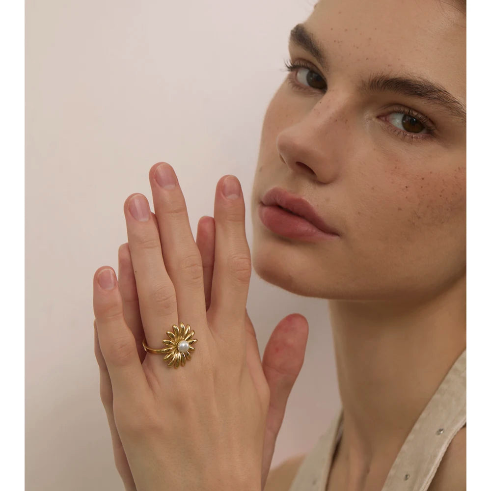 Close up of pearl ring showing smooth gold plated texture