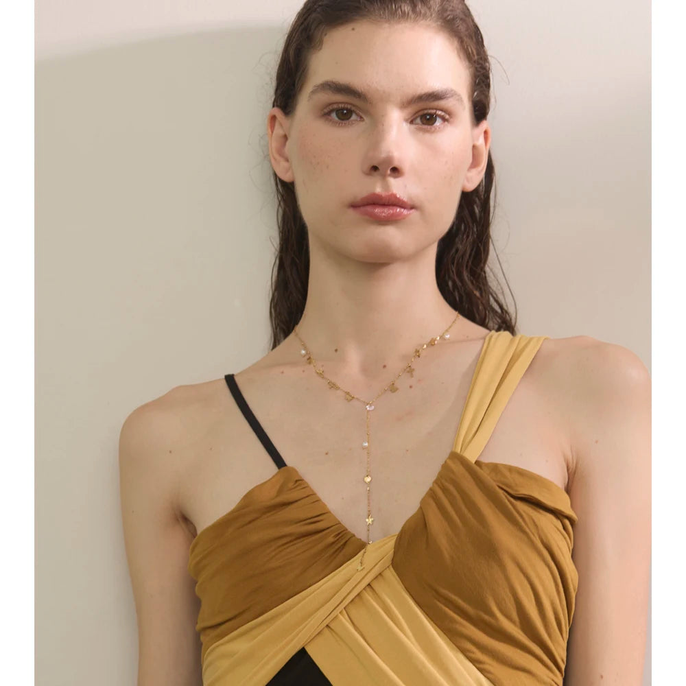 Close-up of zircon sparkle on pendant necklace with smooth gold plating