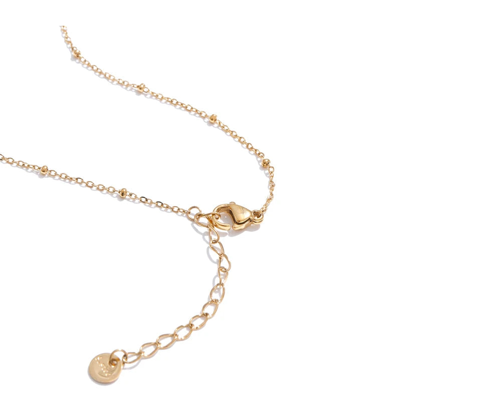 Elegant necklace with gold detailing and butterfly pendant charm