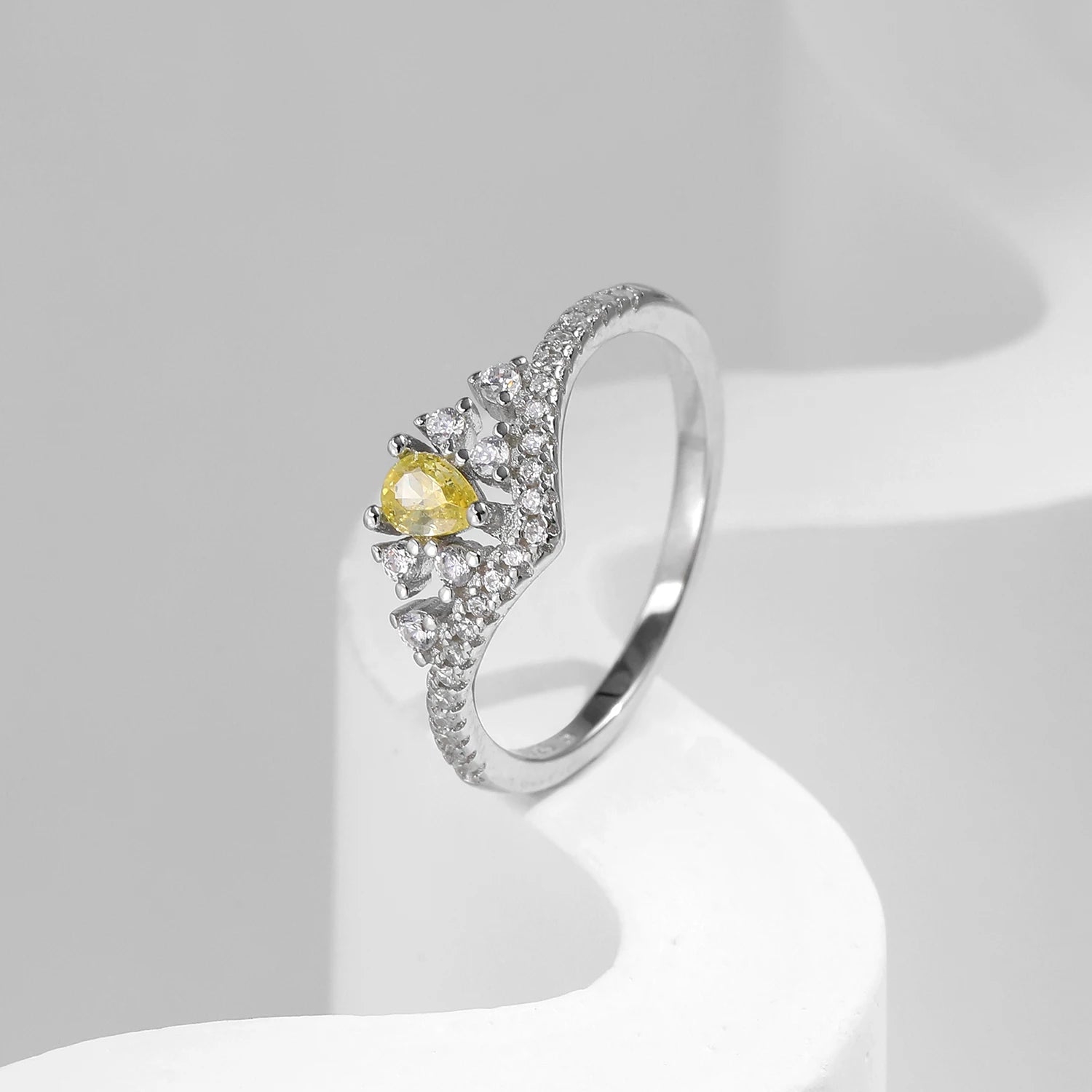 Luxury jewelry silver ring showing yellow cz shine in silver color