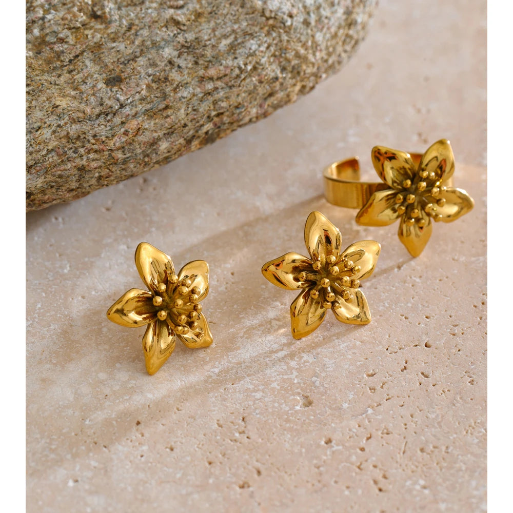 Close up of ear rings showing golden jewelry polish and ring with gold shine