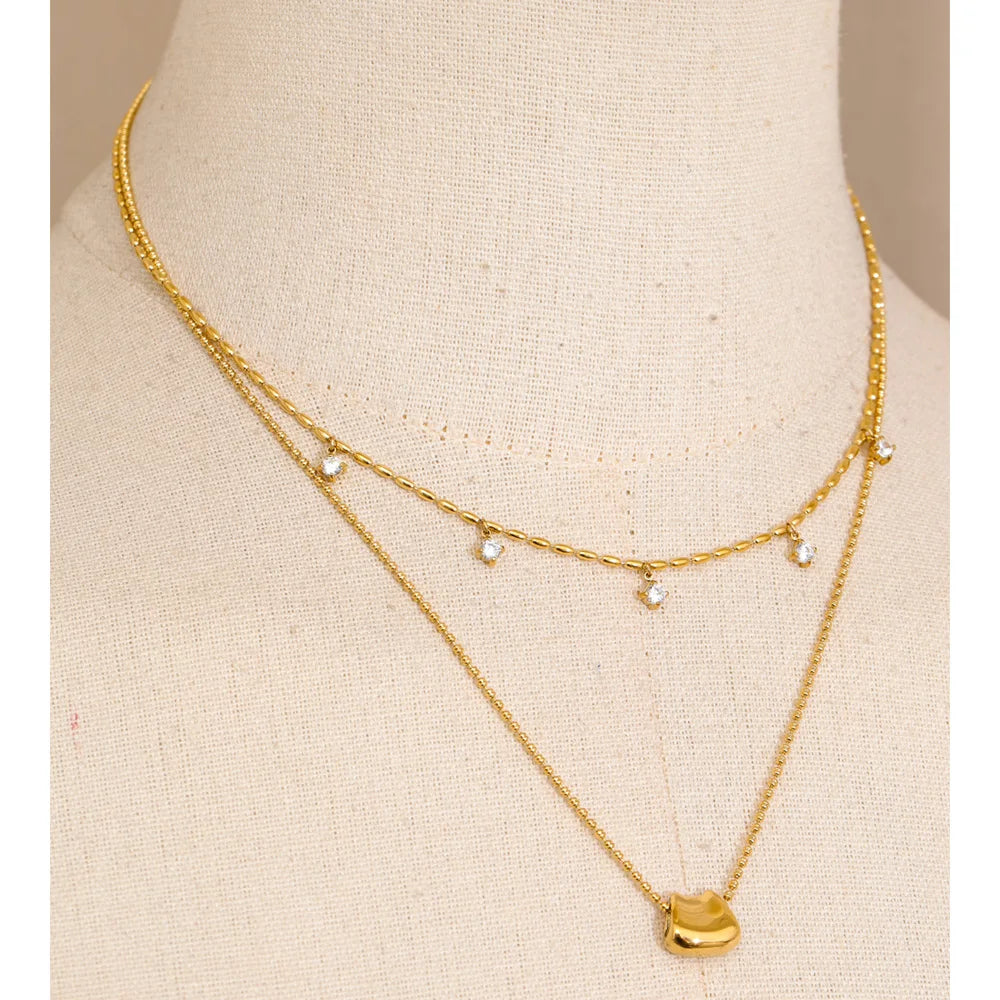 Close up of pendant on a necklace with elegant golden finish