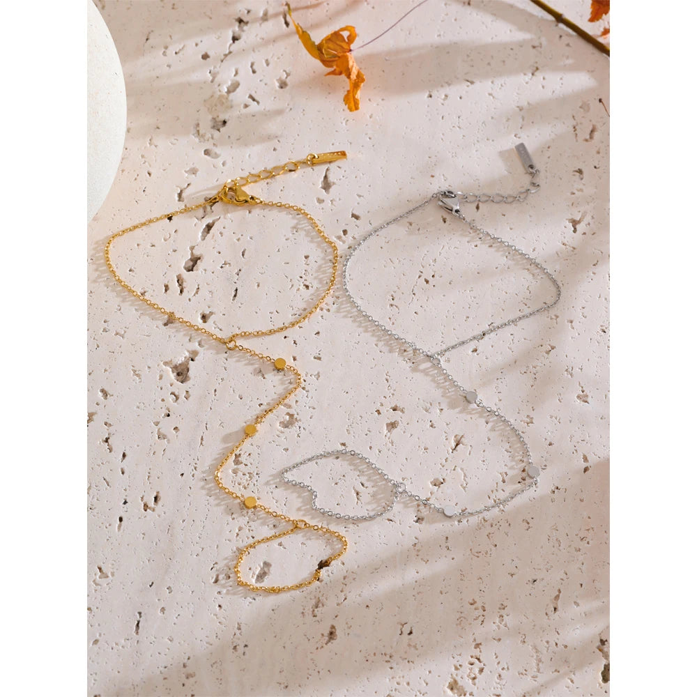 Close view of bracelet chain leading to finger for rings connector as hand in chain