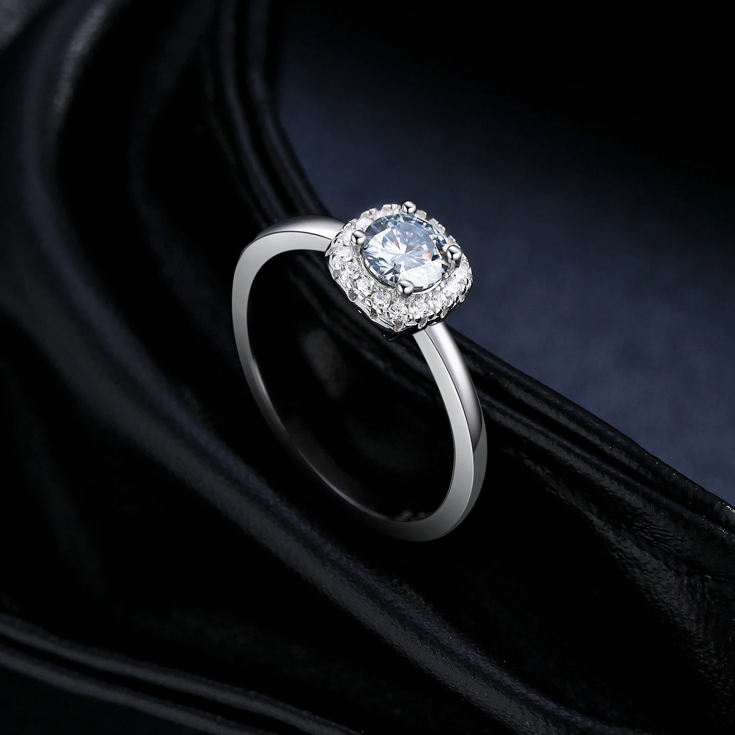 Refined ring with size friendly band holding moissanite diamonds