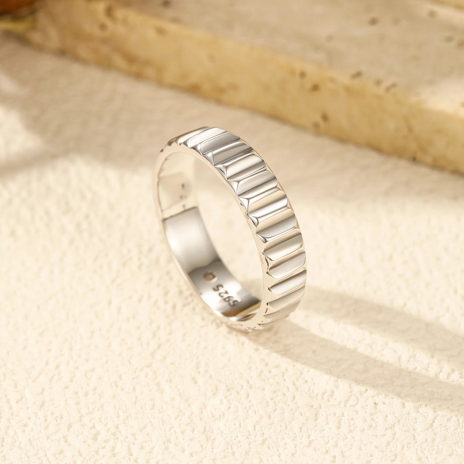 Eternity band ring profile stacked with another sterling silver ring