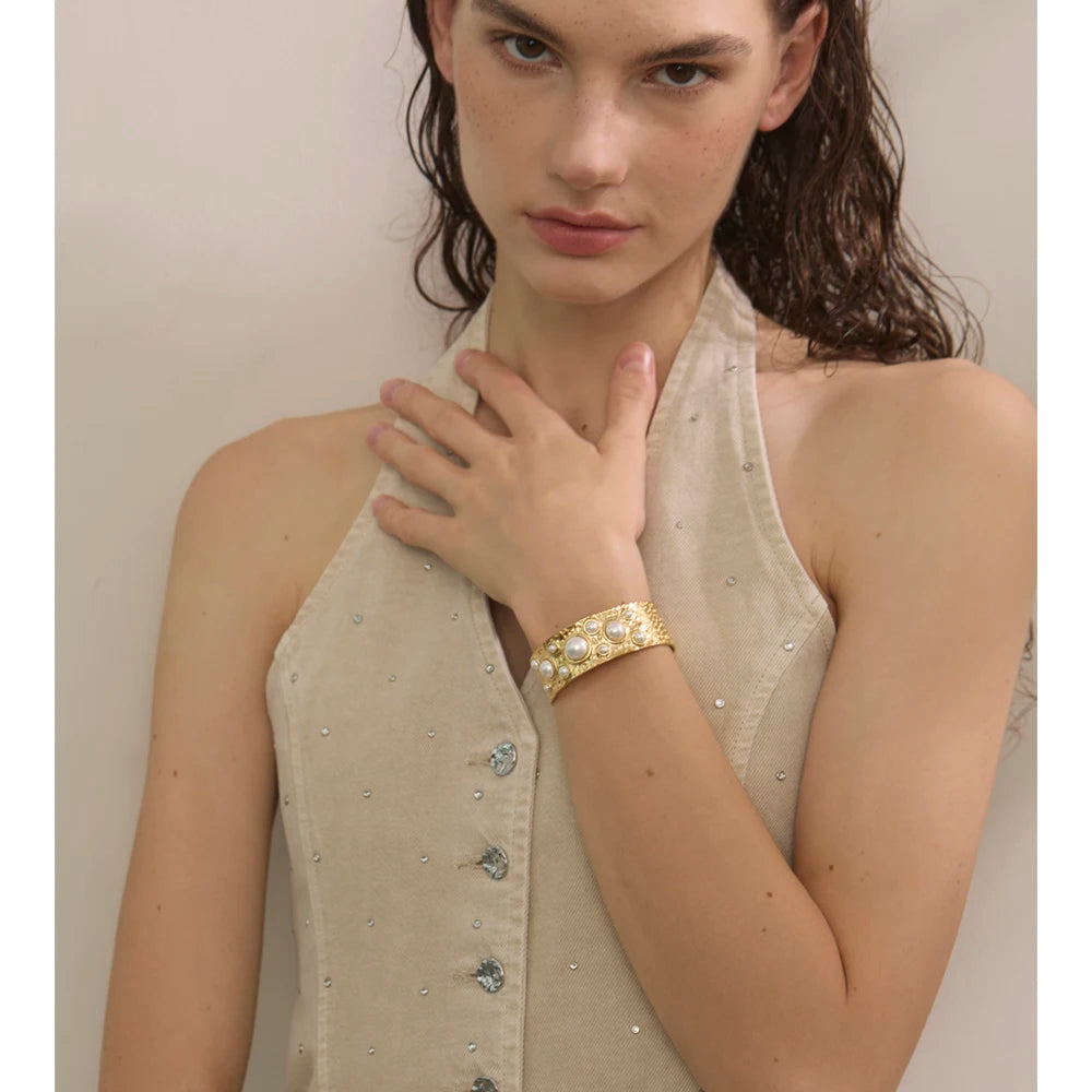 Close up of hammered bangle bracelet with matching ring