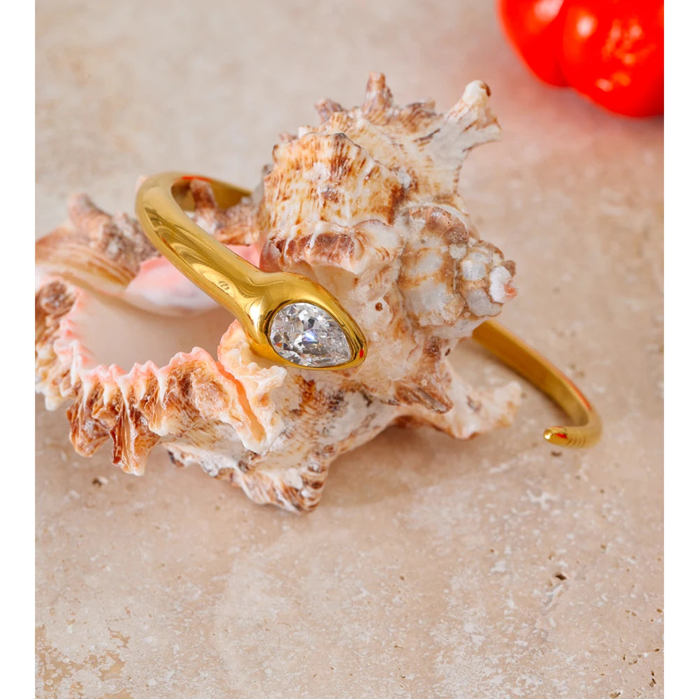 Elegant cuff bracelet featuring polished gold plated shine