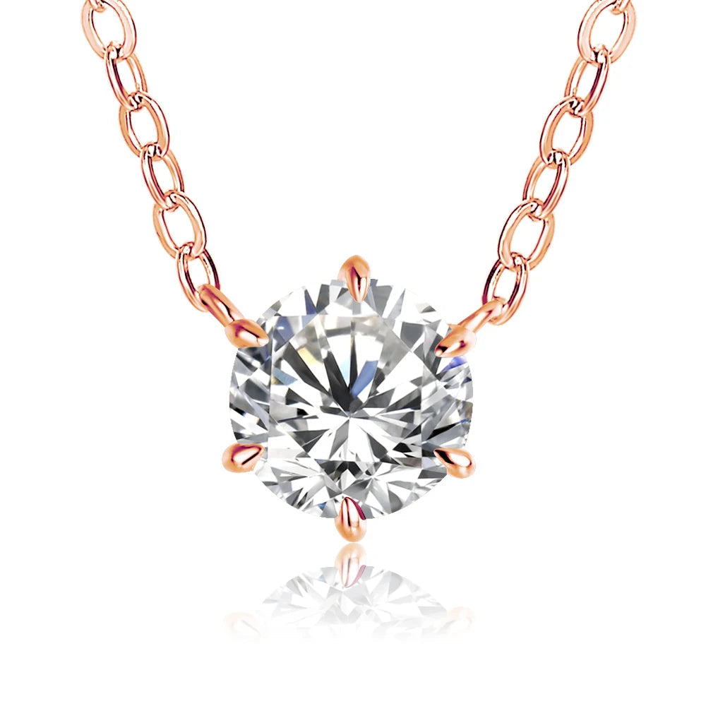 Rose gold necklace stack shown with a sterling silver moissanite pendant