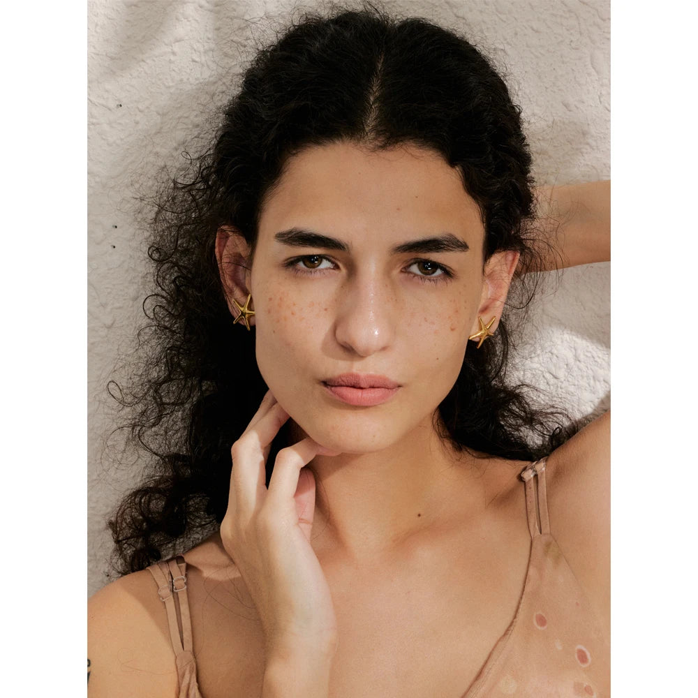 Close view of earrings starfish motif with smooth posts and earring earrings comfort