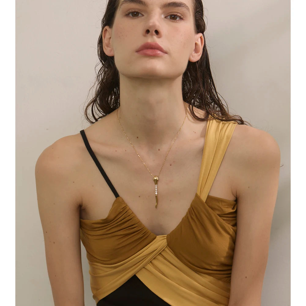 Close up of necklace and pendant with cubic zirconia snake design