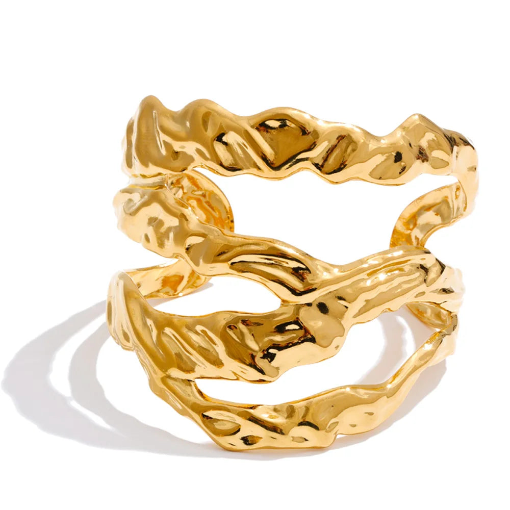 Chic gold plated accessory set on wrist and fingers close up