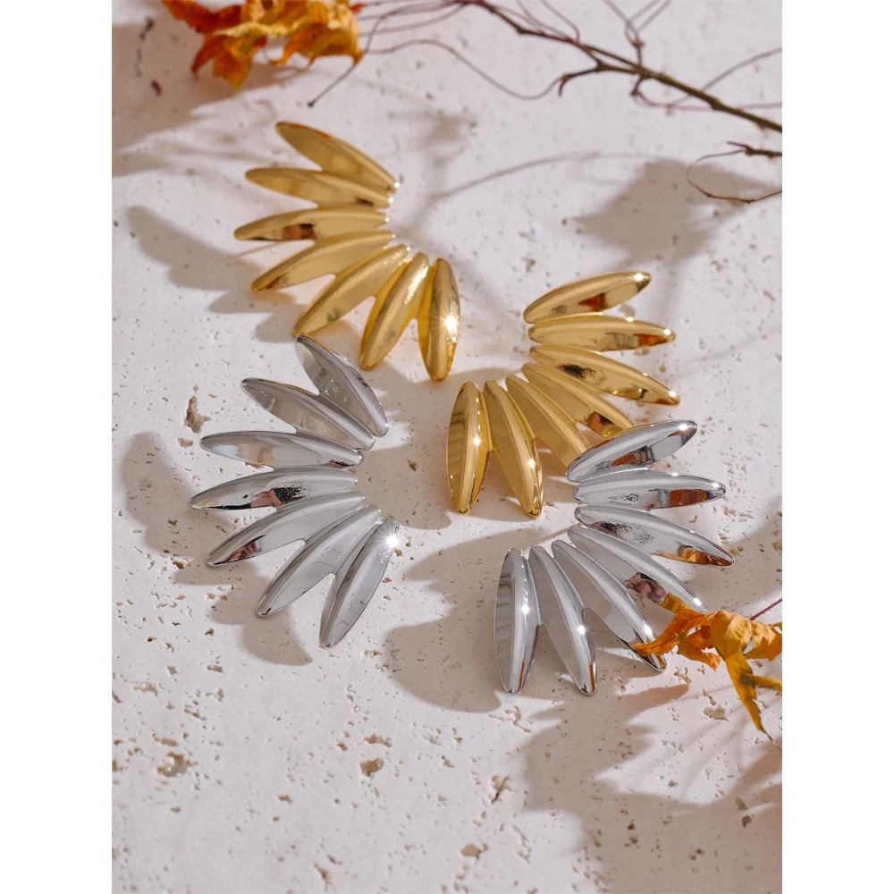 Gold earrings gold design showing modern stud style