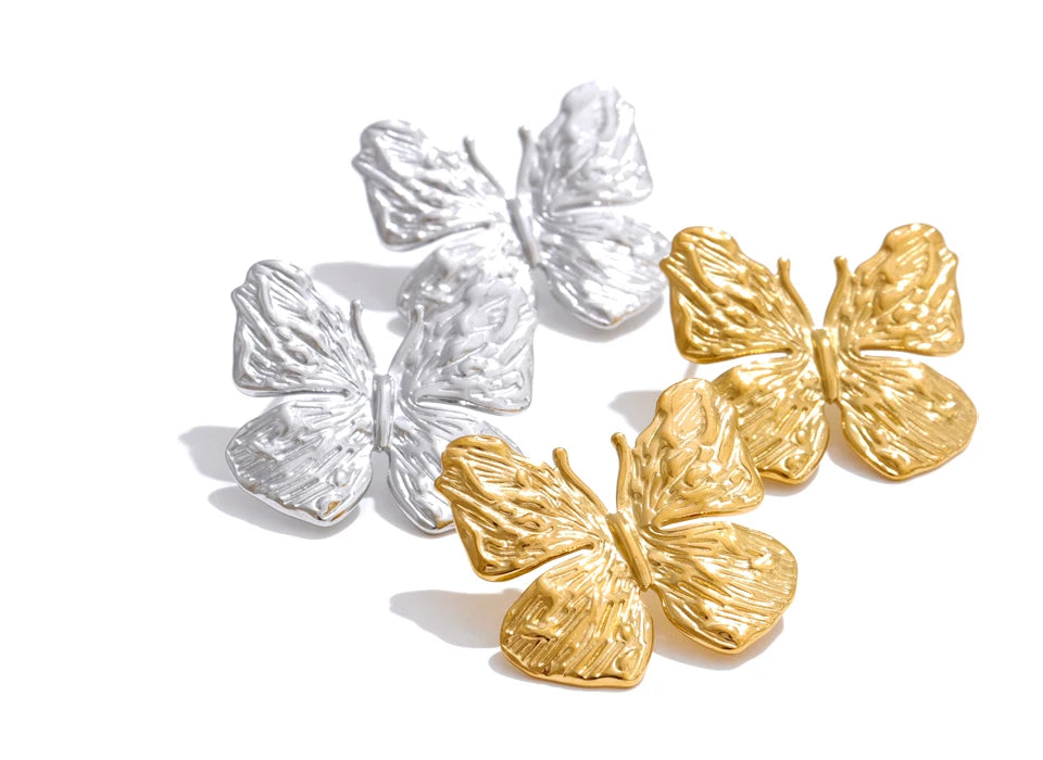 Side angle of butterfly earrings highlighting earrings earrings gold sparkle