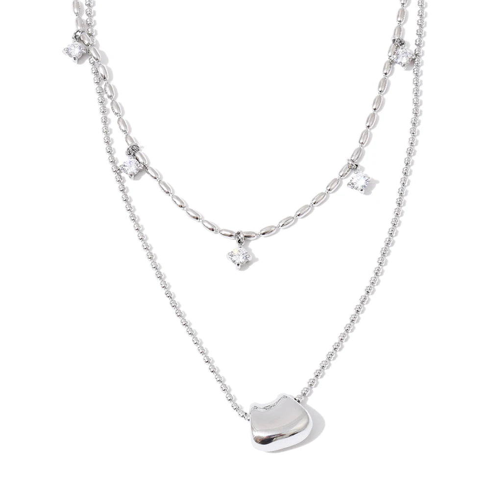 Stylish pendant a necklace detail with layered gold finish