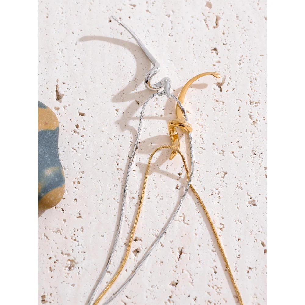 Close view of pendant necklace showing necklace with a charm detail