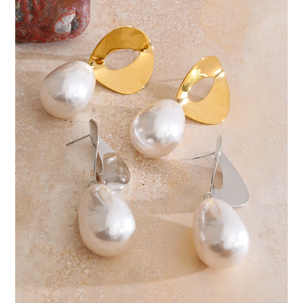 Elegant pearl drop earrings with gold plated finish on stainless setting