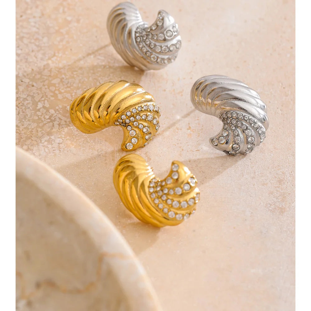 Close up of stud earrings gold earrings with zirconia sparkle