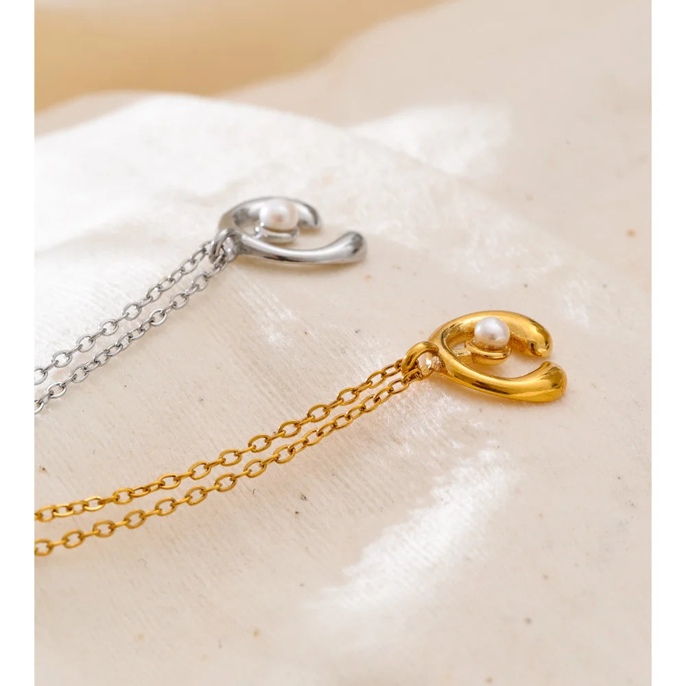 Close up of pearl with necklace detail and polished chain