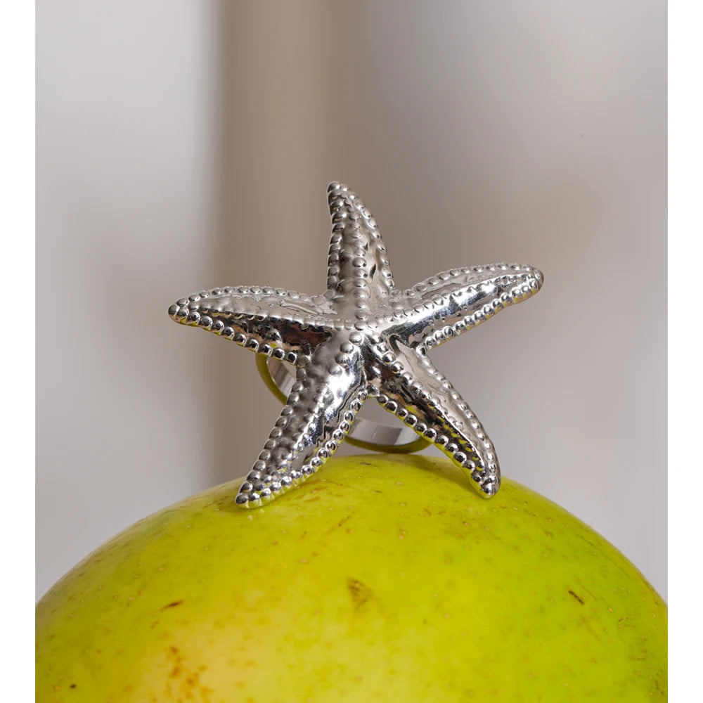 Stainless steel jewelry ring with coastal inspired texture