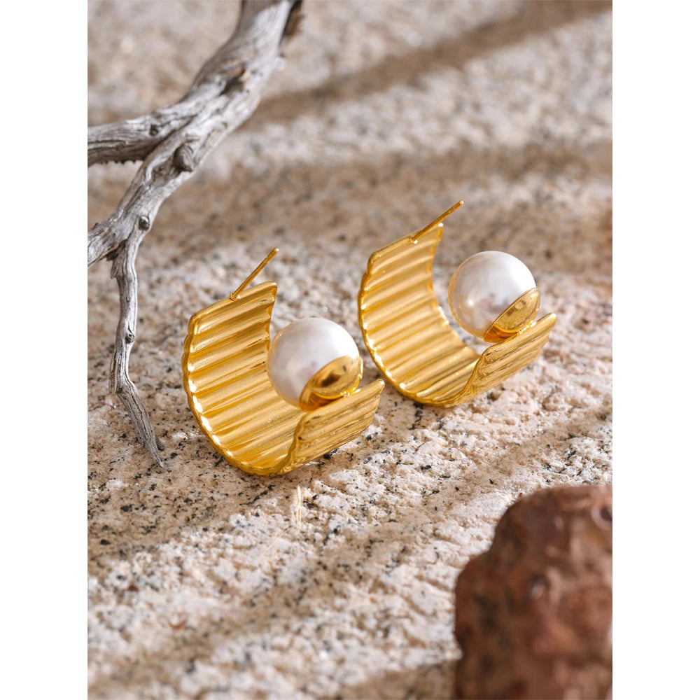 Close view of ear rings showing hoop earrings curve and earrings pearl glow