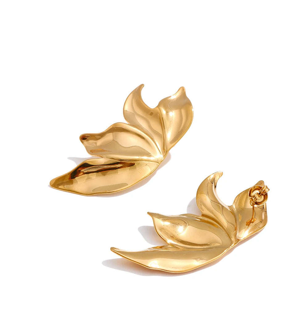 A gold earrings pair featuring metal flower stud accents
