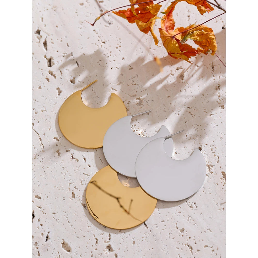 Close up of ear rings showing gold plated shine with earrings gold earrings pairing