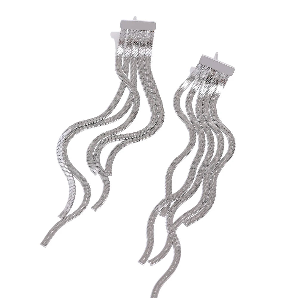 A gold earrings silhouette with subtle chain gold chain movement