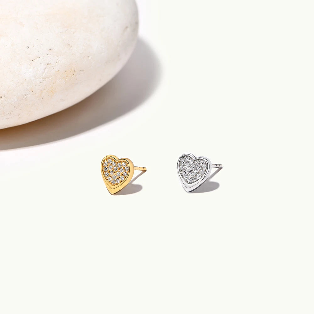 Diamond earrings look created by moissanite earrings on a silver setting