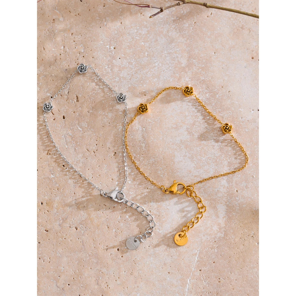 Chain bracelet with subtle charm bracelets detail and gold plated finish