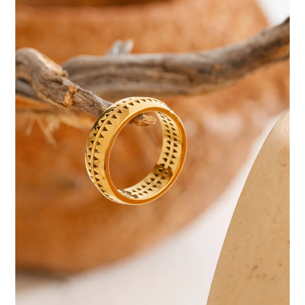 Golden jewelry statement ring with hollow triangle