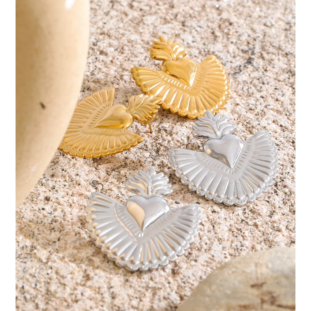 Close up of gold heart earrings stylish geometric design