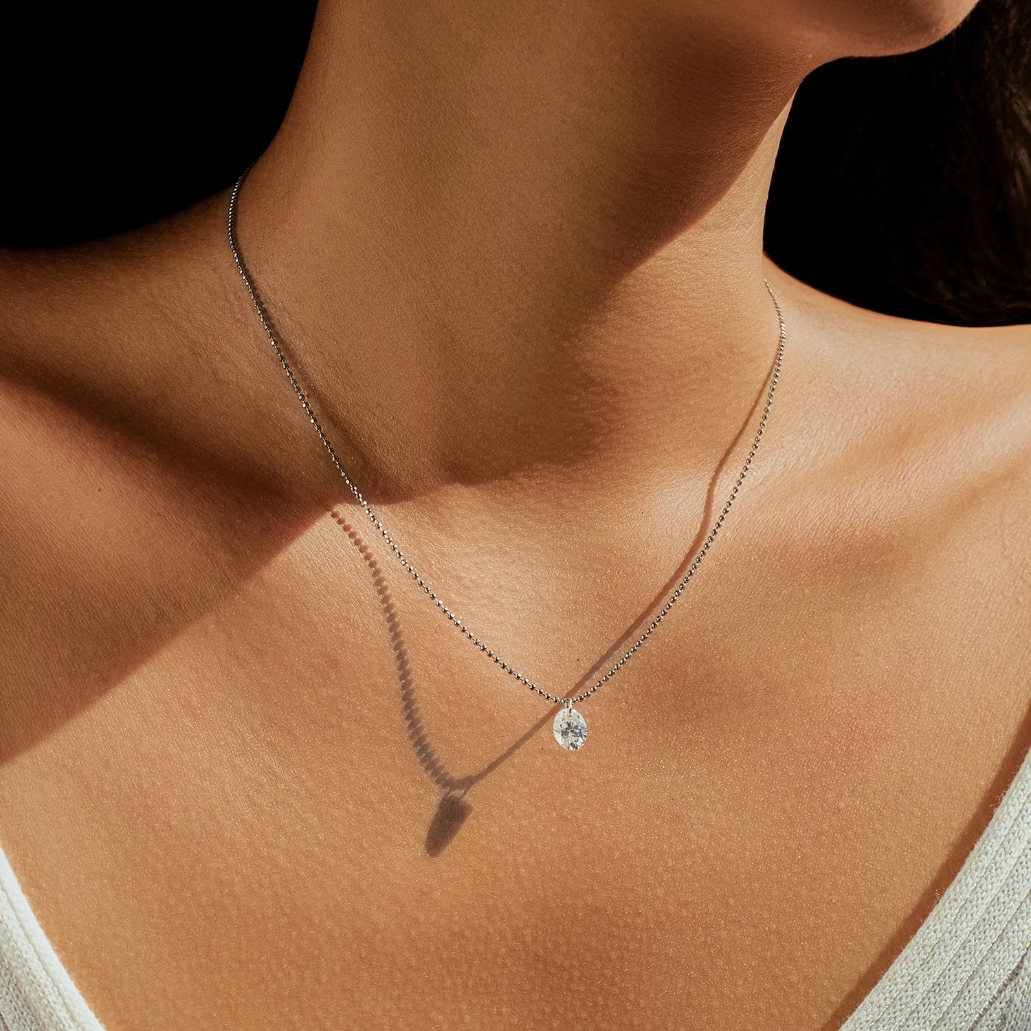 Sterling silver necklace for women featuring a large moissanite diamond