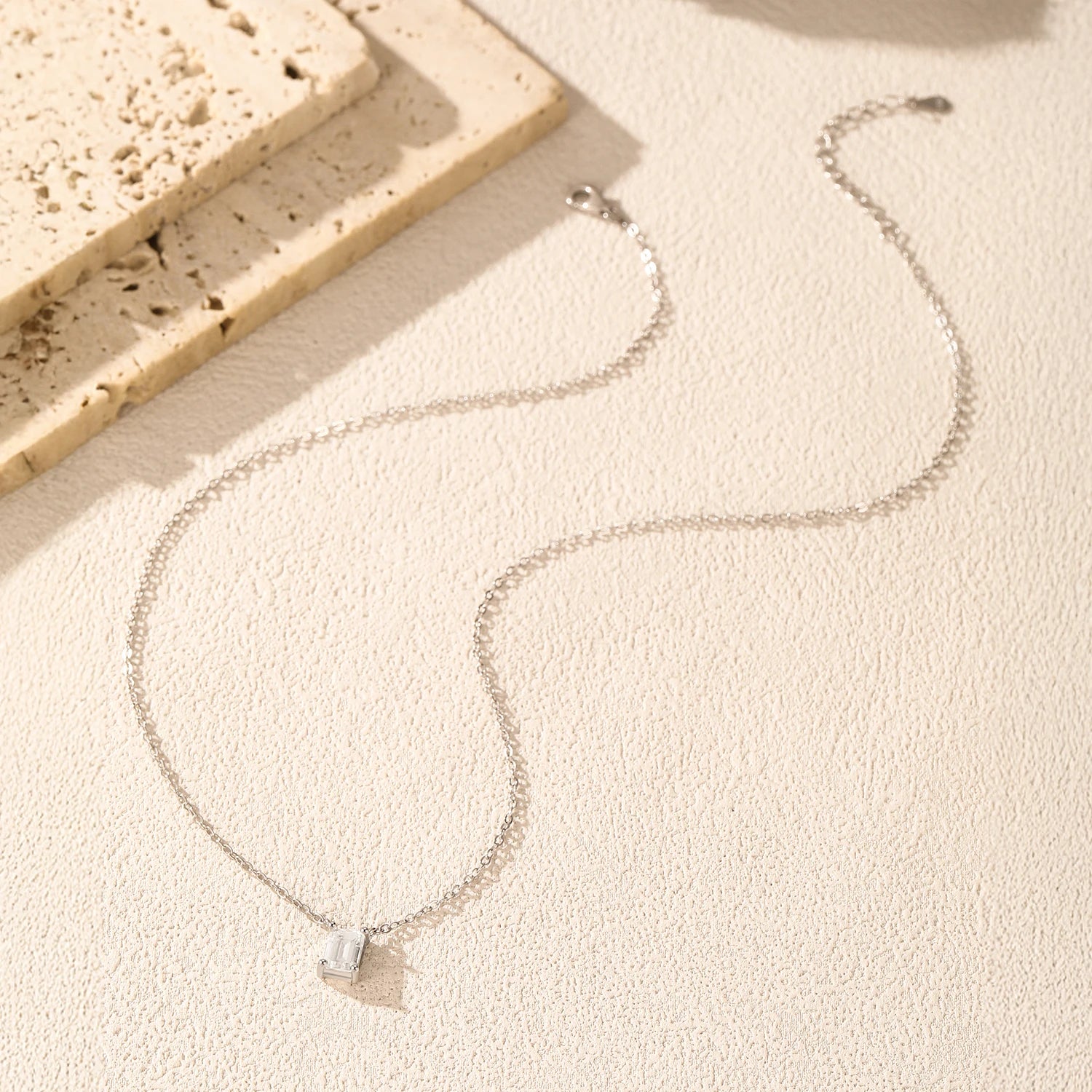 Women necklace combining moissanite jewelry charm and silver chain design