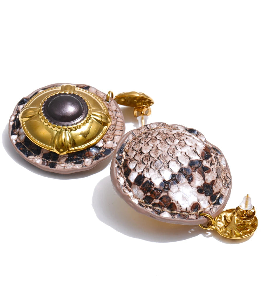 Elegant earrings and gold accents with enamel detail