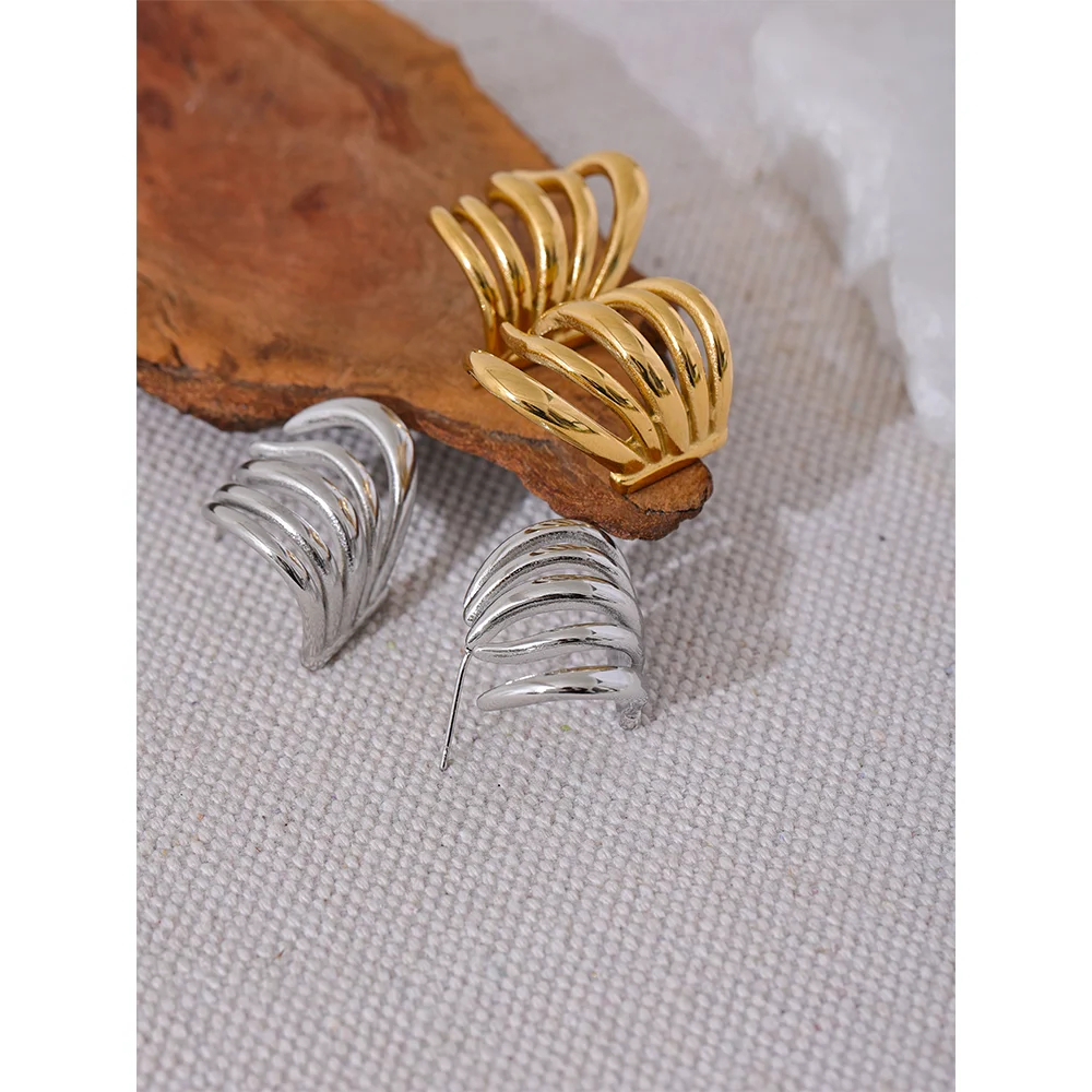 Gold hoop earrings for women styled with stainless earrings