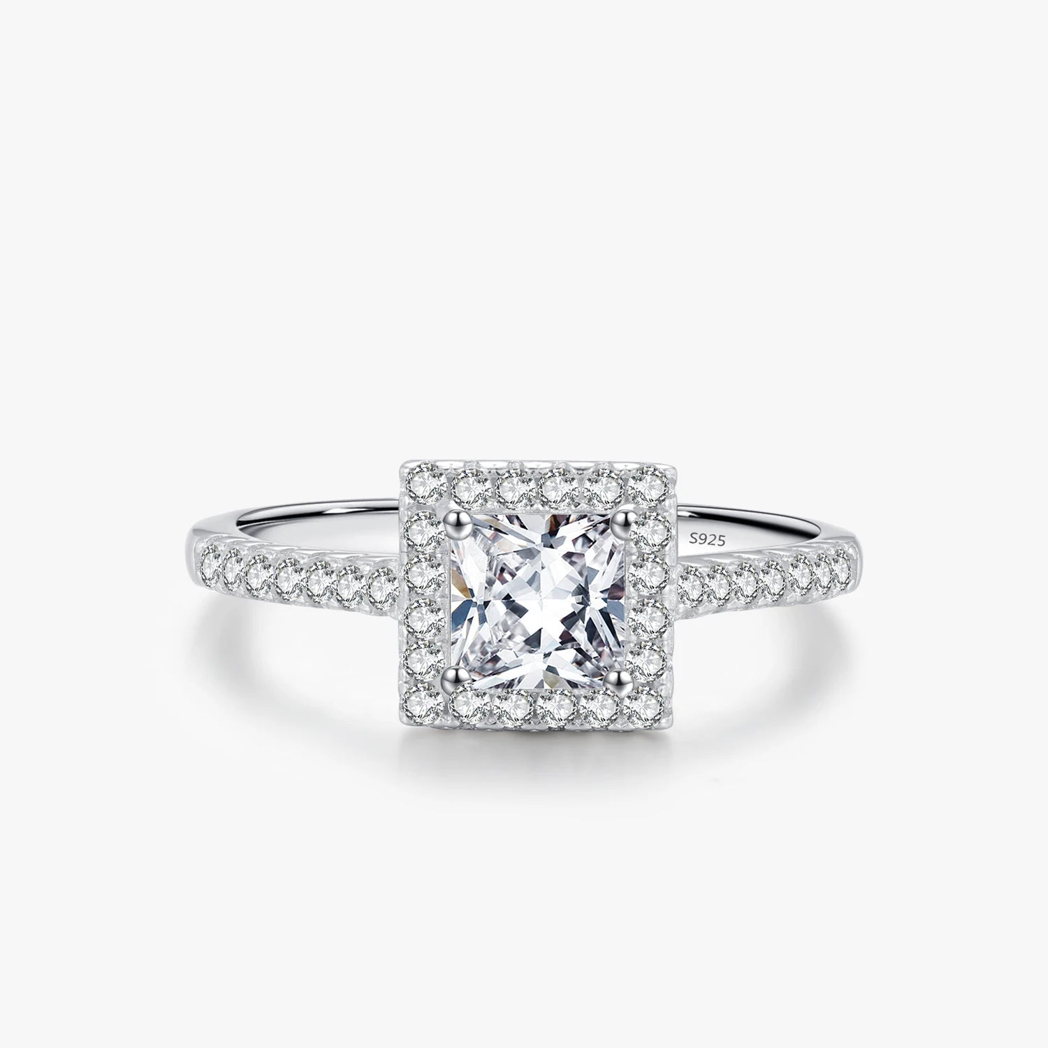 Silver wedding ring beside card to confirm ring size from ring