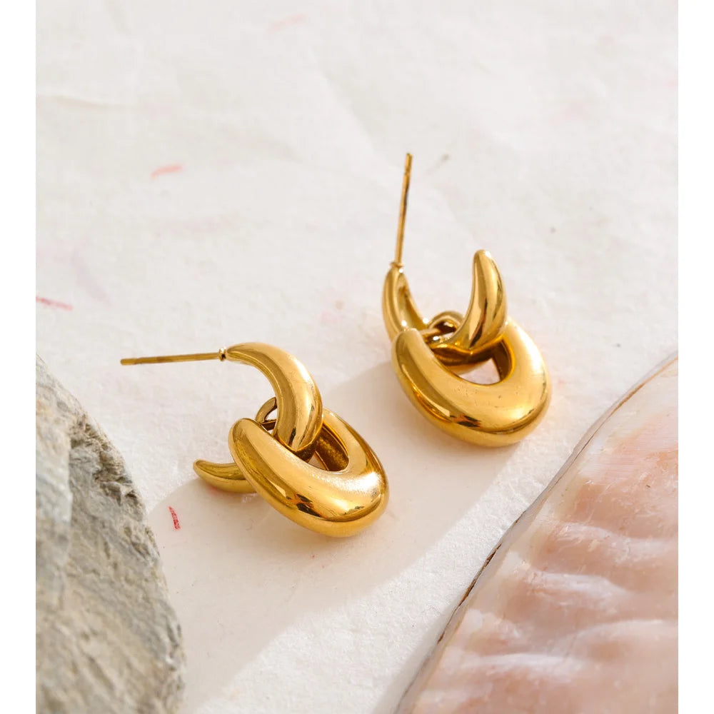 Elegant earrings gold earrings design with smooth metal texture