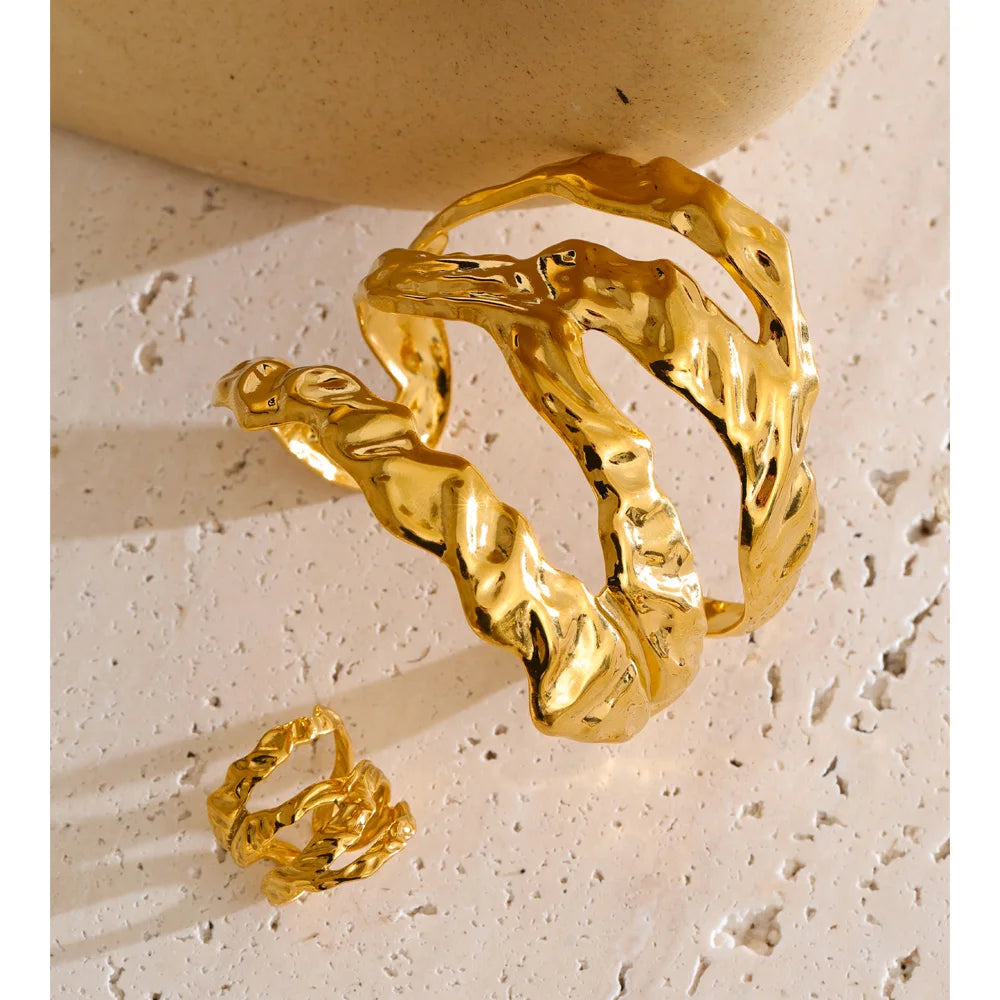 Wide layered bangle and bangle set showcasing gold plated shine