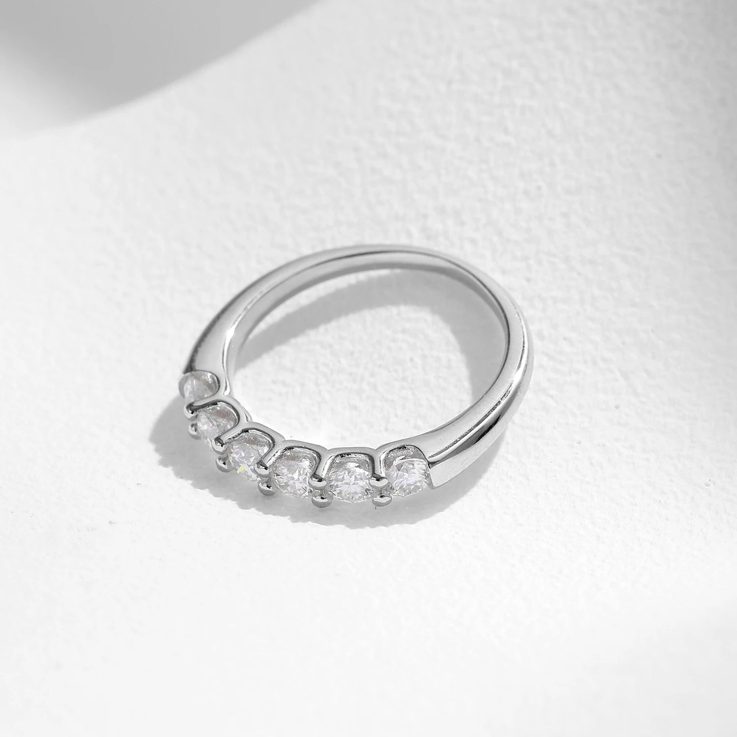 Ring size from ring chart beside a VVS1 moissanite eternity band ring