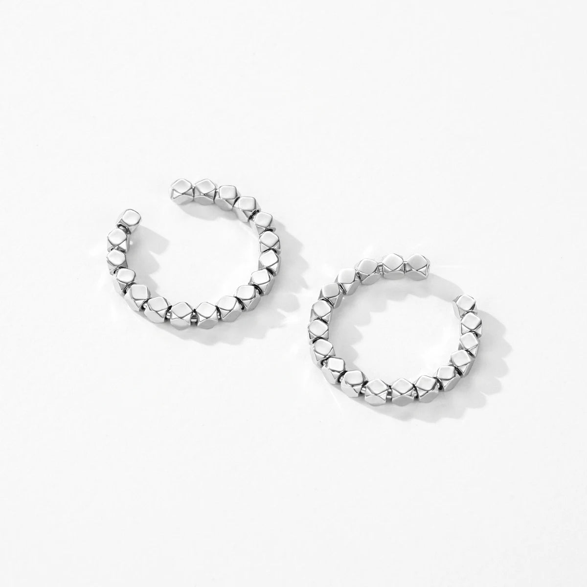 Hand wearing an adjustable sterling ring with subtle ring platinum appeal