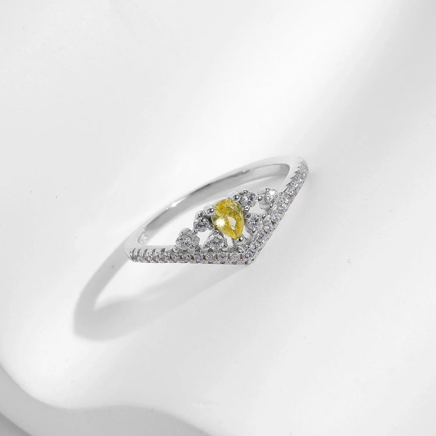 Sterling silver ring with yellow cz accents and classic crown jewelry feel