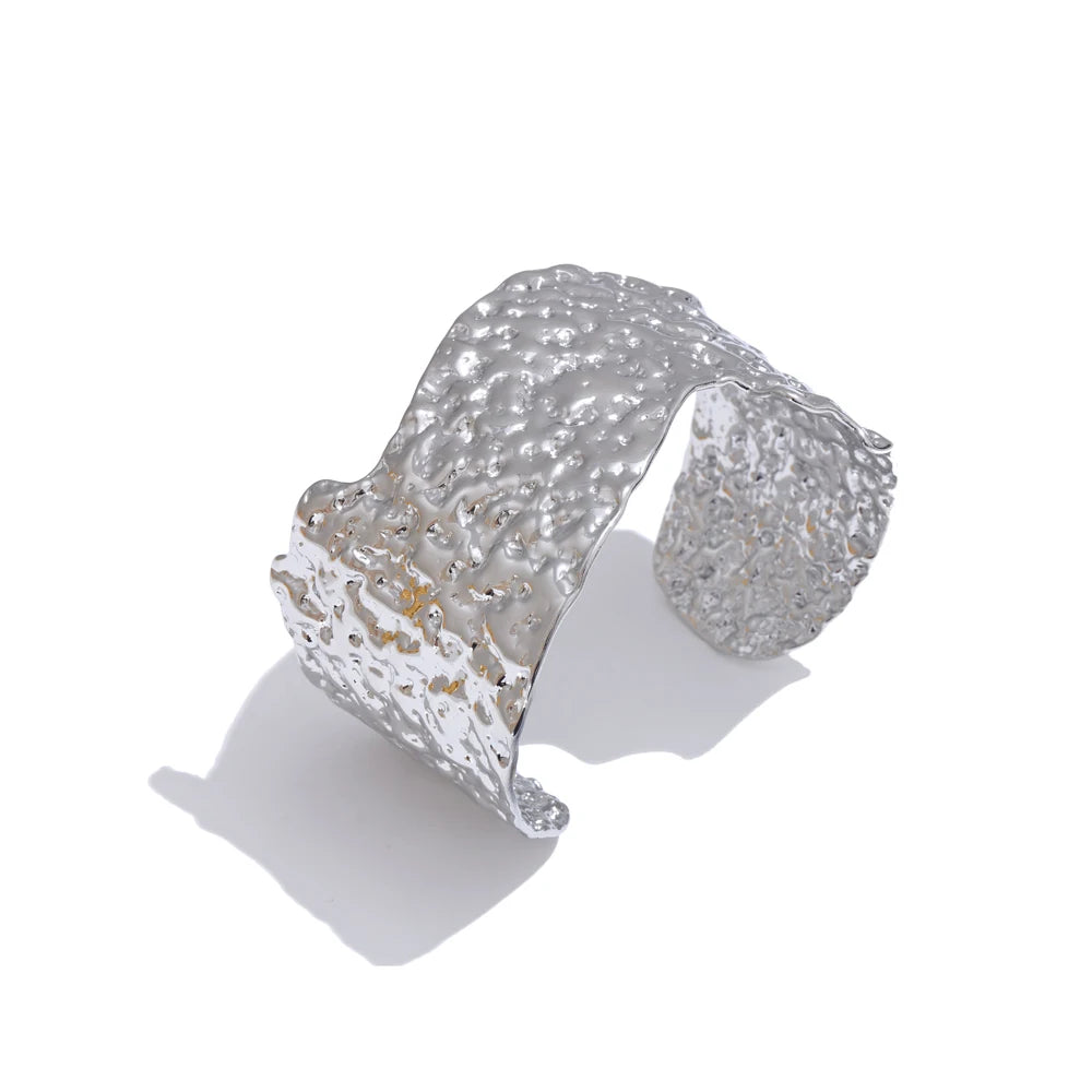 Gold bracelet cuff hammered texture under light
